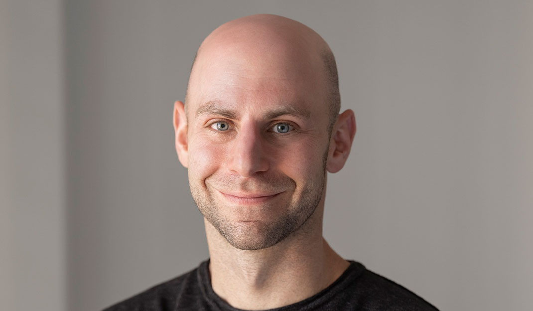 Headshot of Adam Grant, organizational psychologist at Wharton, bestselling author, and host of the podcast WorkLife
