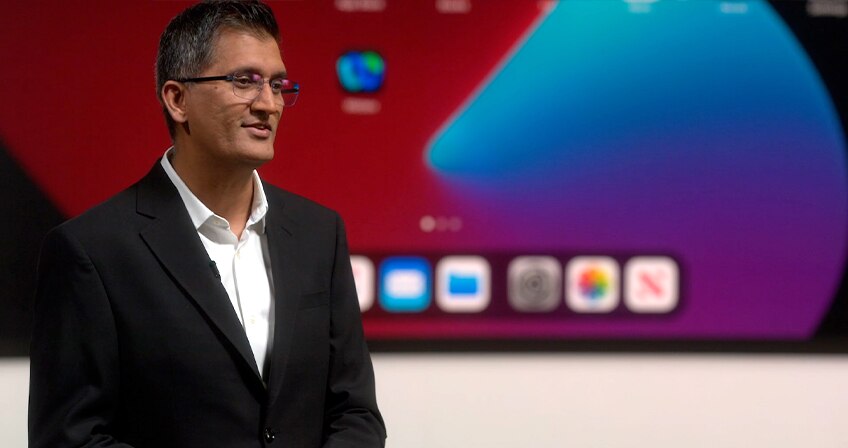 Cisco's Javed Khan, SVP/GM of Collaboration, presents onstage at WebexOne.