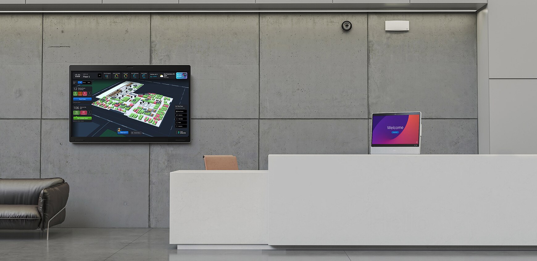 An open ideation space in an office with a couch, aimchair, and a digital whiteboard for brainstorming and collaboration.
